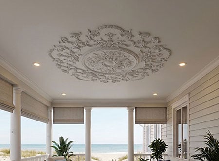 A stylish ceiling featuring an ornate medallion and a contemporary chandelier with glass orbs, illuminating a bright room with large, arched windows. Soft pastel walls complement the elegant design, creating a sophisticated and inviting atmosphere.